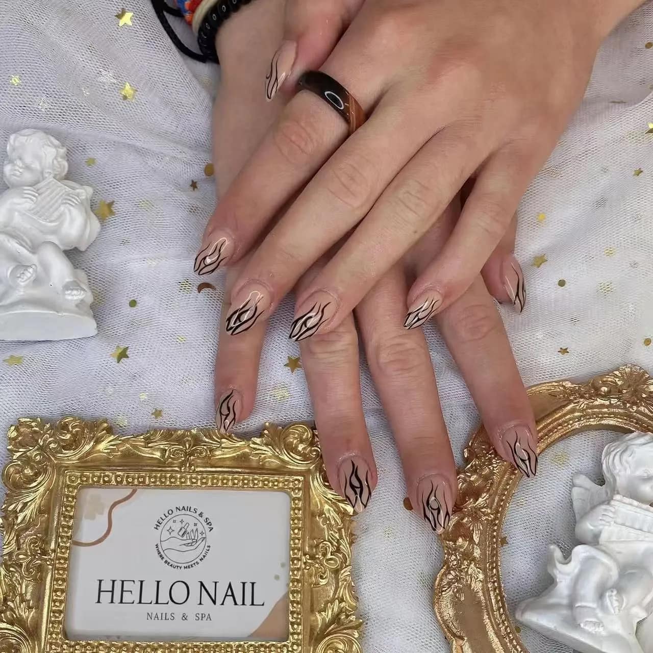 Nude nails with black flame line art