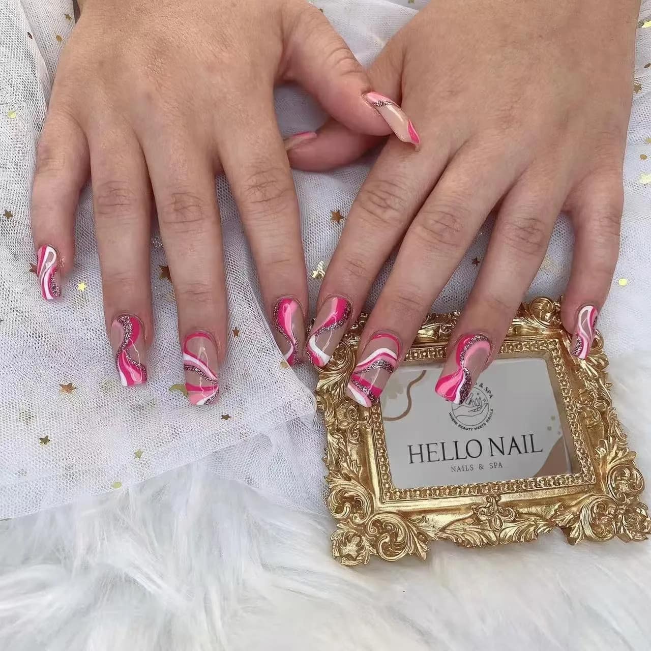 Pink and red swirl nail art