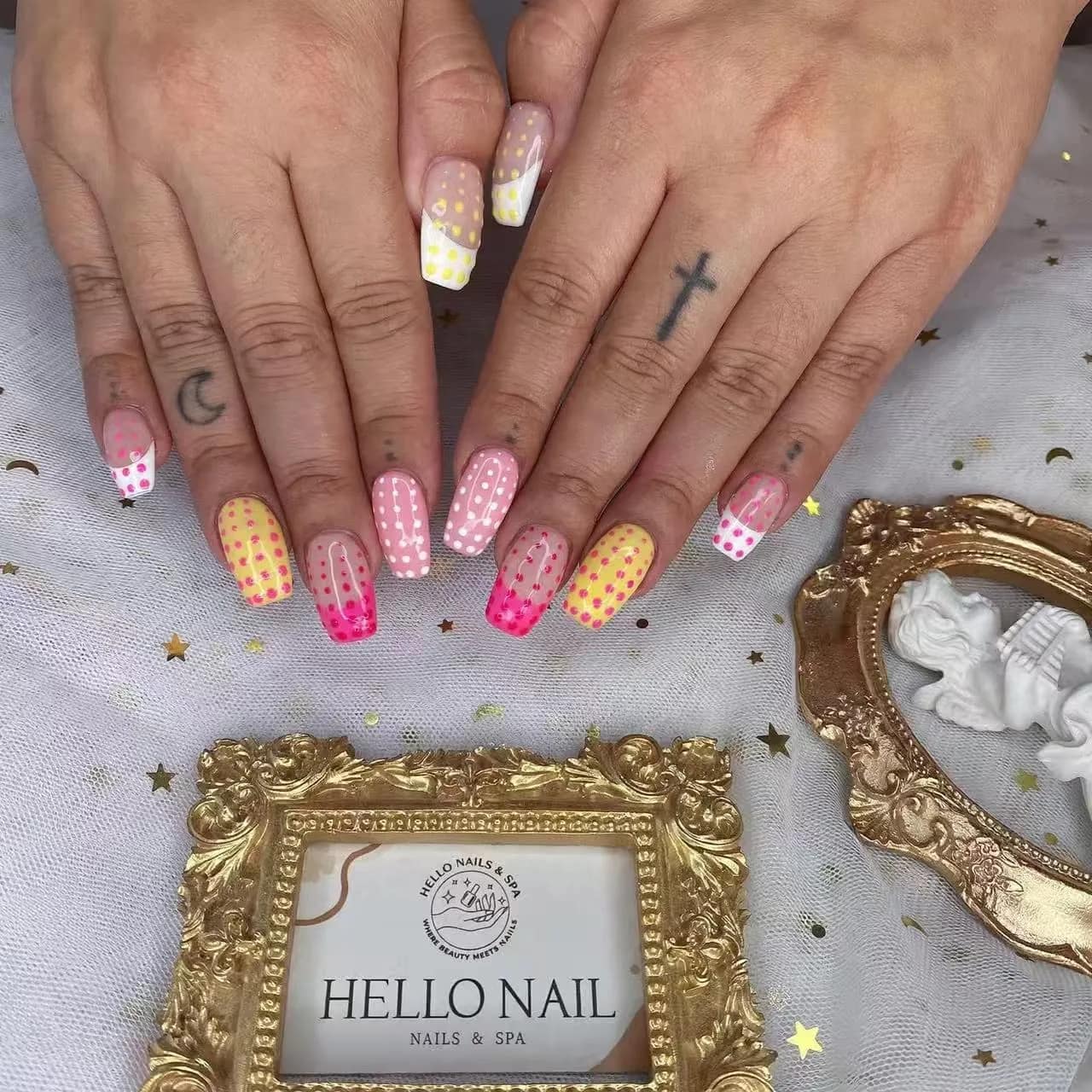 Pink and yellow polka dot nails